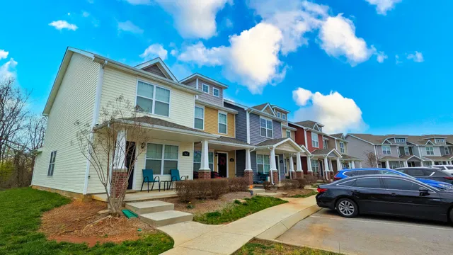 a front view of a house with garden and porch