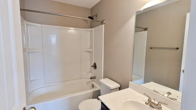 a bathroom with a tub and shower