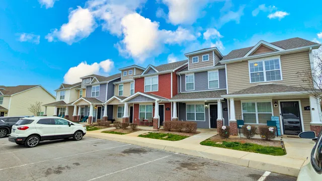 a front view of a house with garden and porch