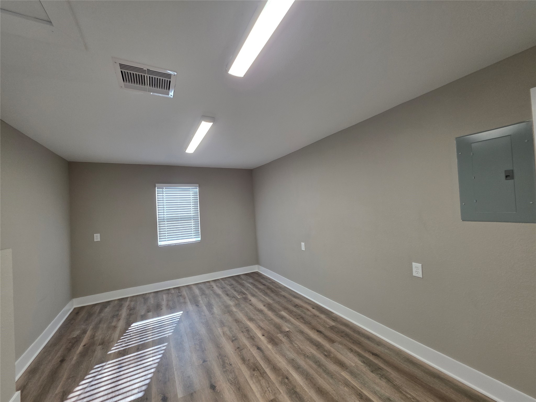 13379 Force Street Houston, TX 77015 - Photo 13 of 21 a view of room with window and hardwood floor