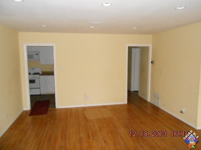 421 West Ave J 9 Lancaster, CA 93534 - Photo 3 of 7 wooden floor in an empty room