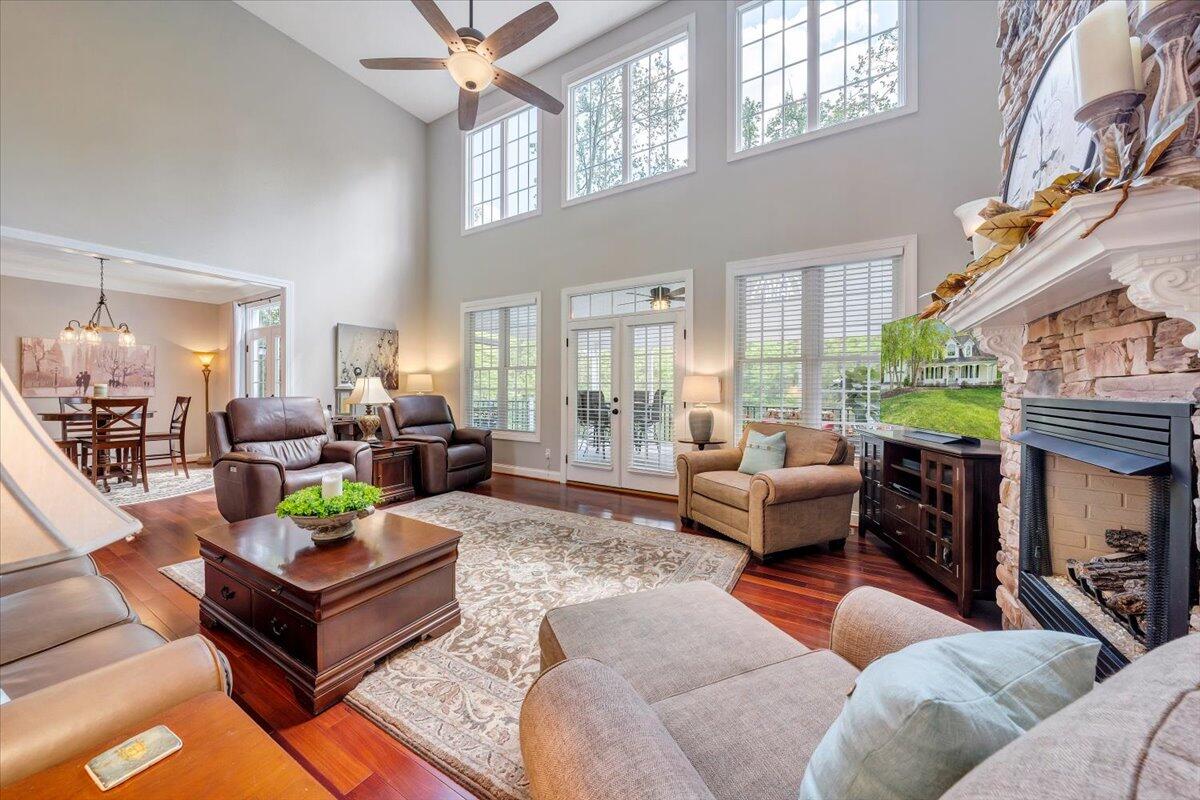 46 Claybrook Court Blue Ridge, VA 24064 - Photo 13 of 76 a living room with furniture a fireplace and a large window