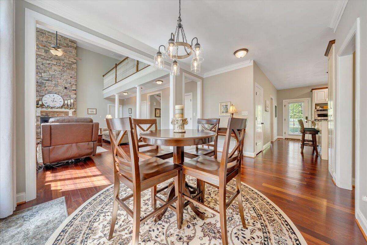 46 Claybrook Court Blue Ridge, VA 24064 - Photo 18 of 76 a view of a dining room and livingroom with furniture wooden floor a chandelier