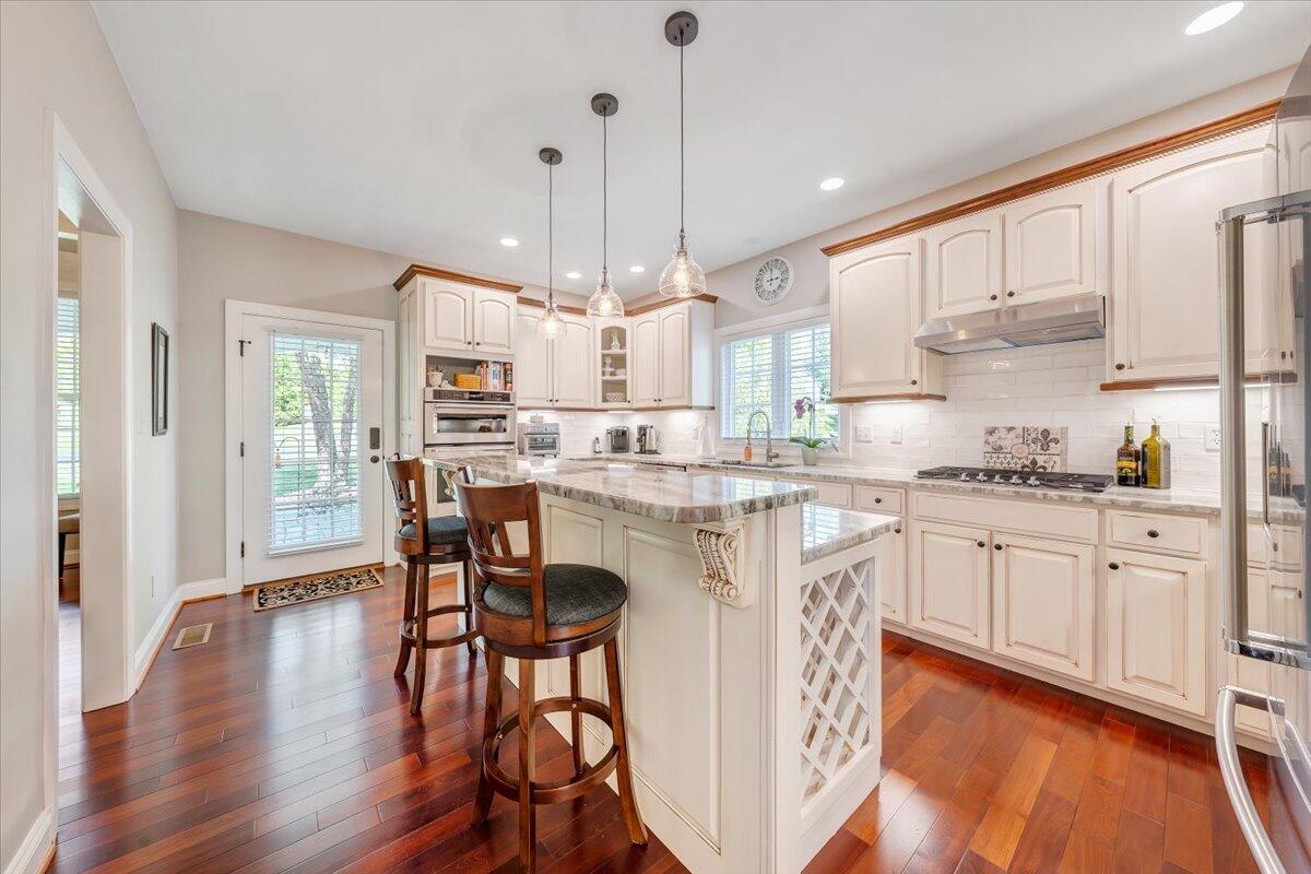 46 Claybrook Court Blue Ridge, VA 24064 - Photo 22 of 76 a kitchen with stainless steel appliances granite countertop a white cabinets and wooden floor