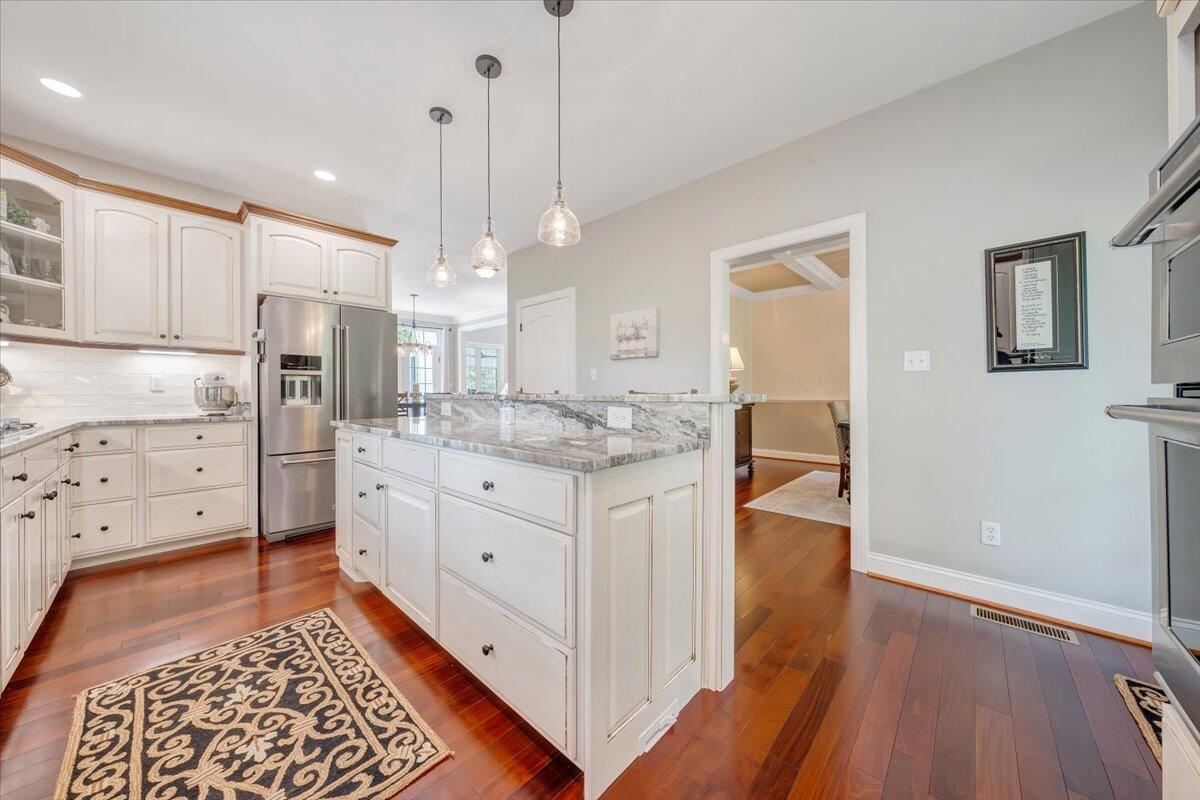 46 Claybrook Court Blue Ridge, VA 24064 - Photo 24 of 76 a open kitchen with white cabinets and stainless steel appliances