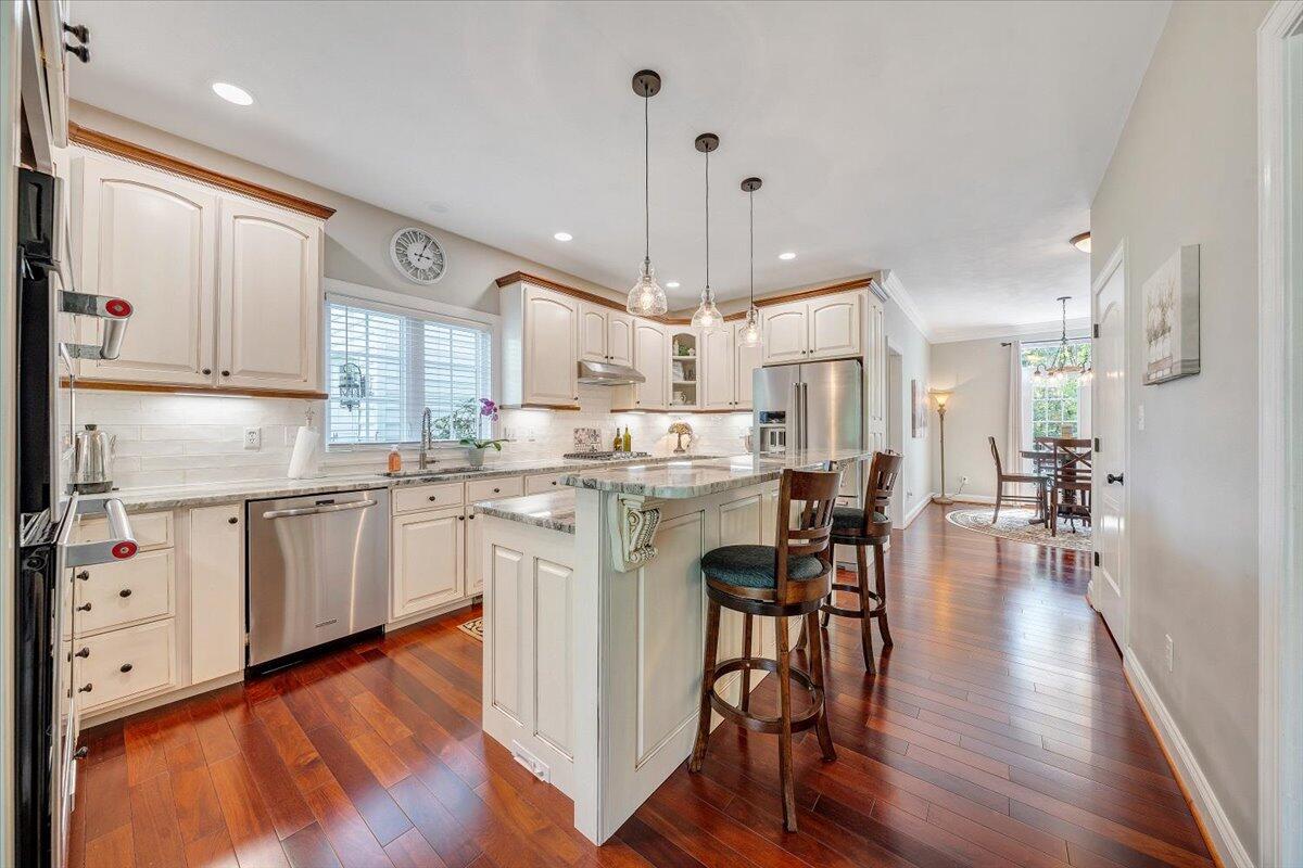 46 Claybrook Court Blue Ridge, VA 24064 - Photo 29 of 76 a kitchen with stainless steel appliances a dining table chairs stove a refrigerator and cabinets