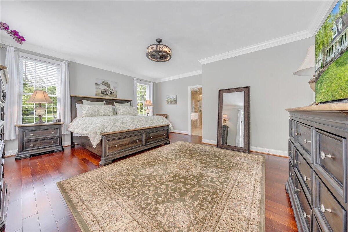 46 Claybrook Court Blue Ridge, VA 24064 - Photo 31 of 76 a spacious bedroom with a bed and a dresser with wooden floor
