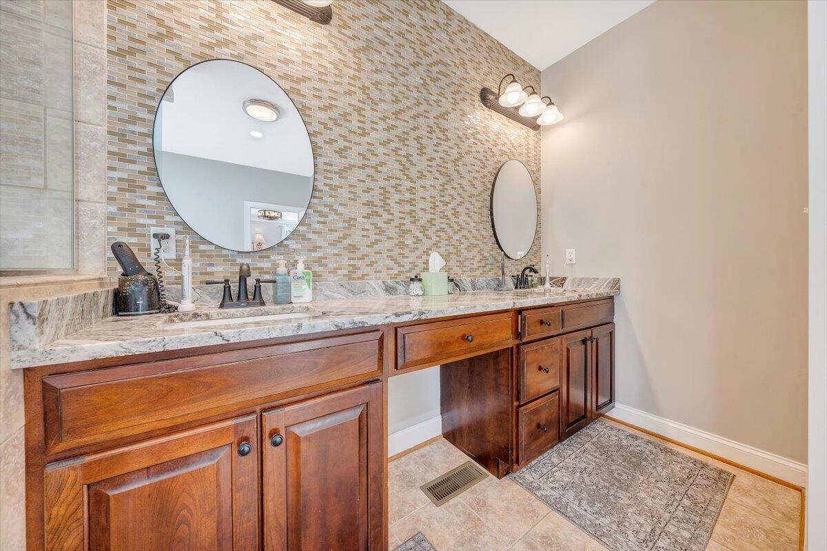 46 Claybrook Court Blue Ridge, VA 24064 - Photo 34 of 76 a bathroom with a sink mirror and vanity