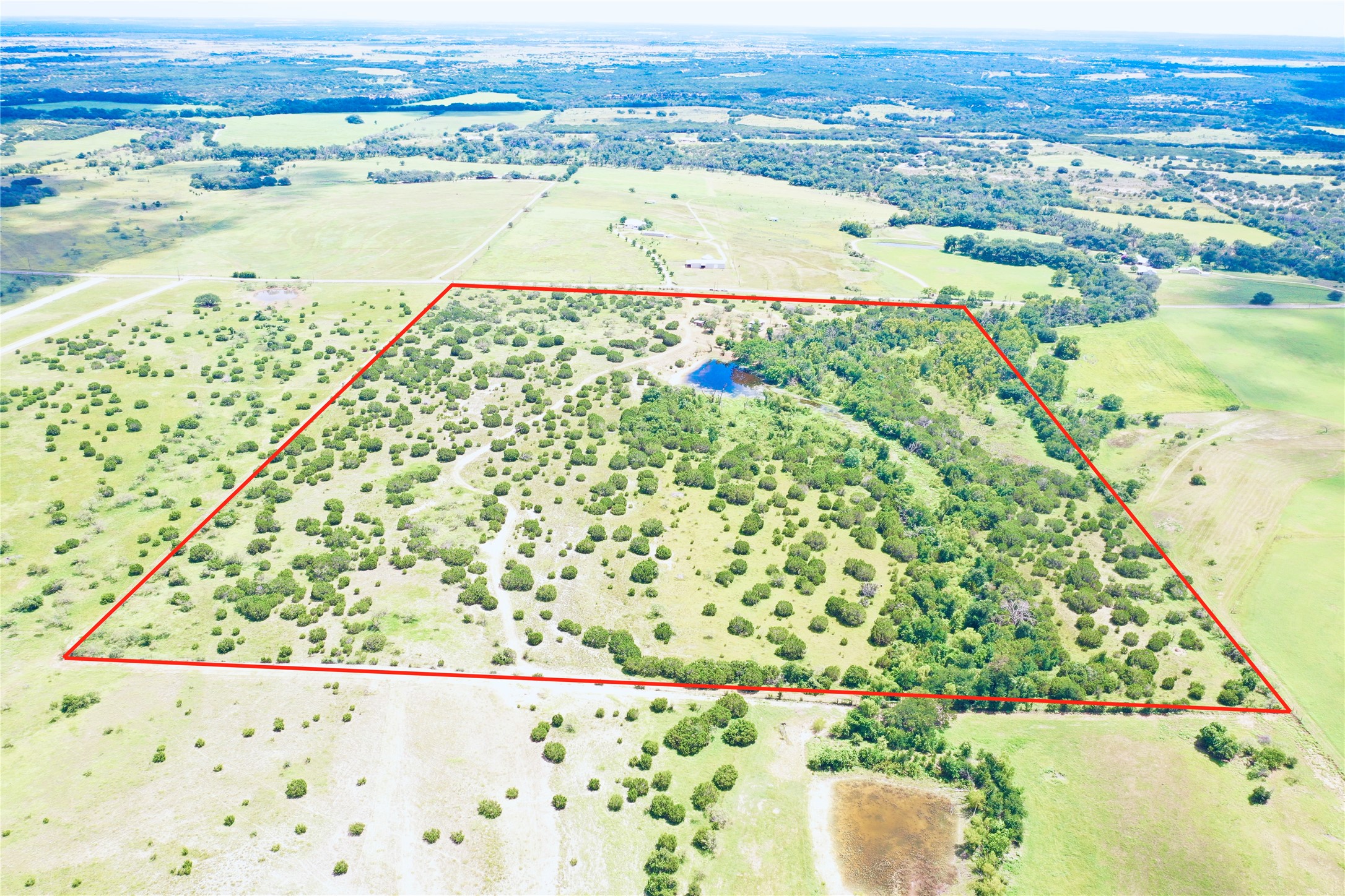 210 Rd Bertram Tx 78605 Road Bertram, TX 78605 - Photo 4 of 5 The 18.99 acre tract is on the left side of this photo. boundaries highlighted