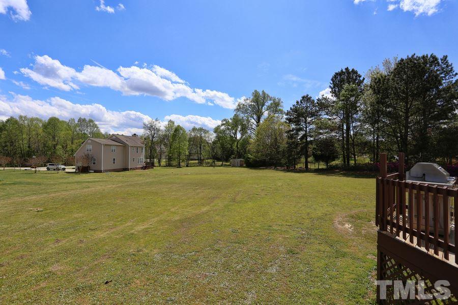 236 Hunters Farm Drive Raleigh, NC 27603 - Photo 19 of 21 a view of a house with a yard