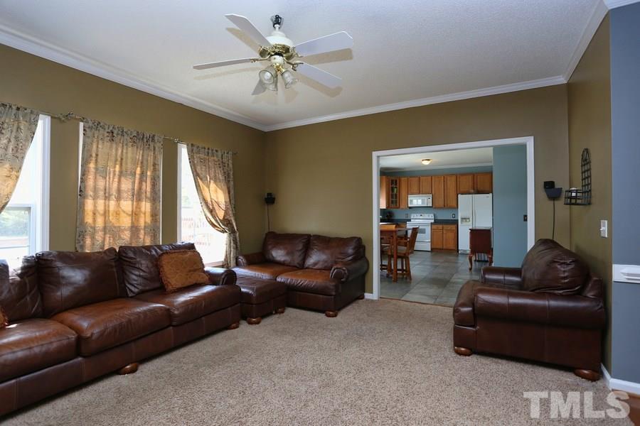 236 Hunters Farm Drive Raleigh, NC 27603 - Photo 3 of 21 a living room with furniture and a large window