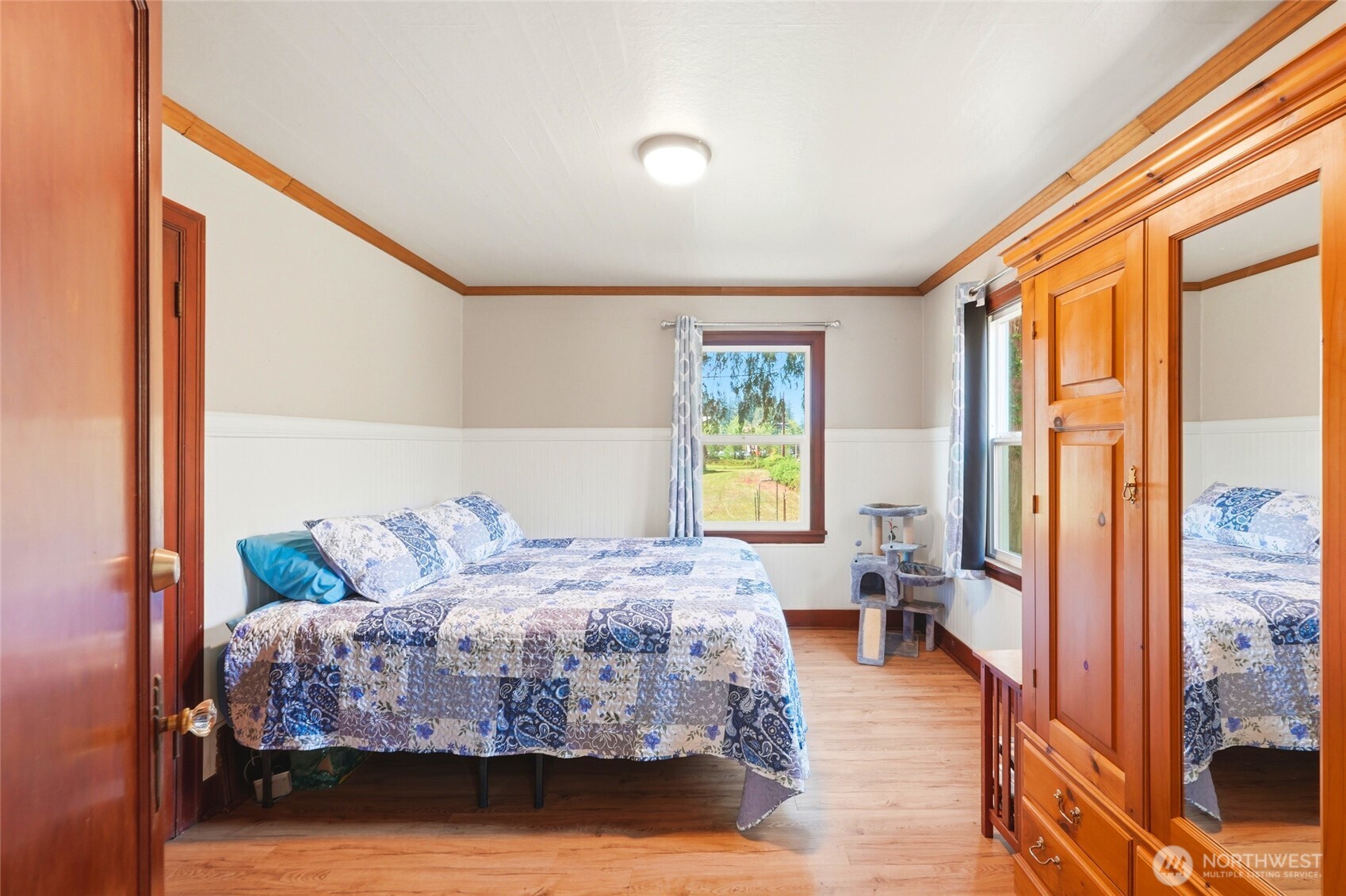 21716 State Rte 530 Northeast Arlington, WA 98223 - Photo 15 of 38 a bedroom with a bed and wooden floor