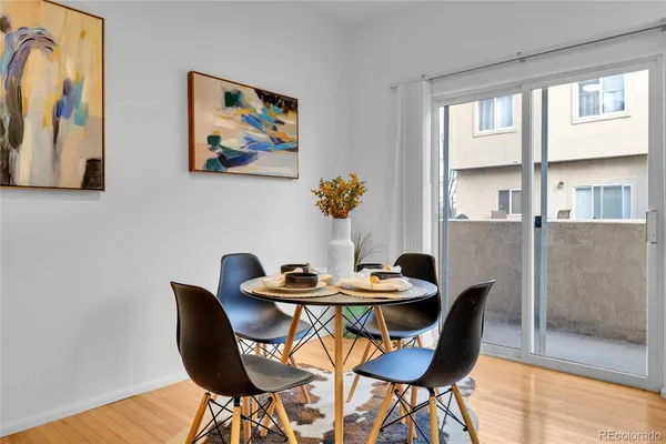 a dining room with furniture and window