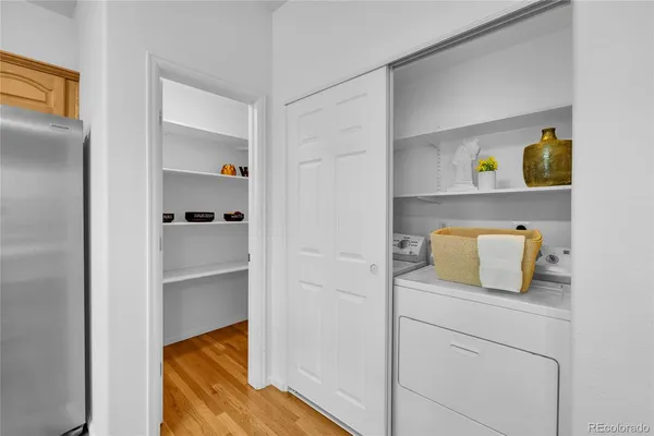 a kitchen with a refrigerator and cabinets