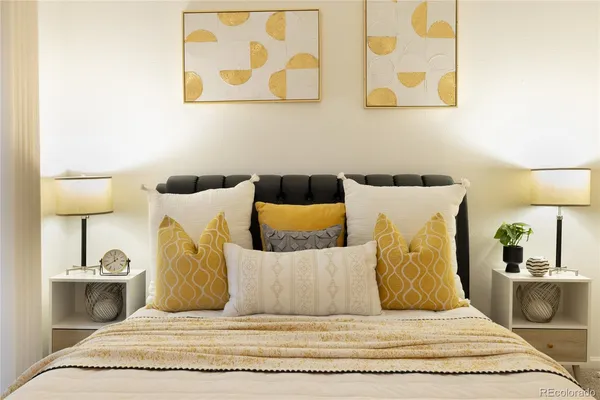 a bedroom with a bed and lamp