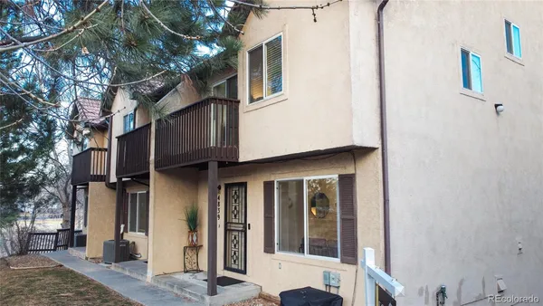 a view of a house with a tree