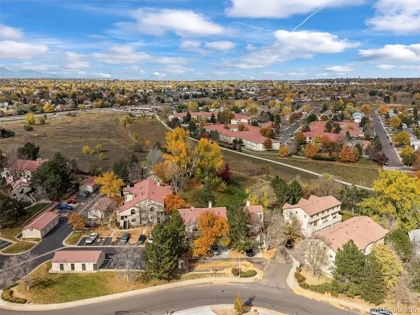 an aerial view of residential houses with outdoor space