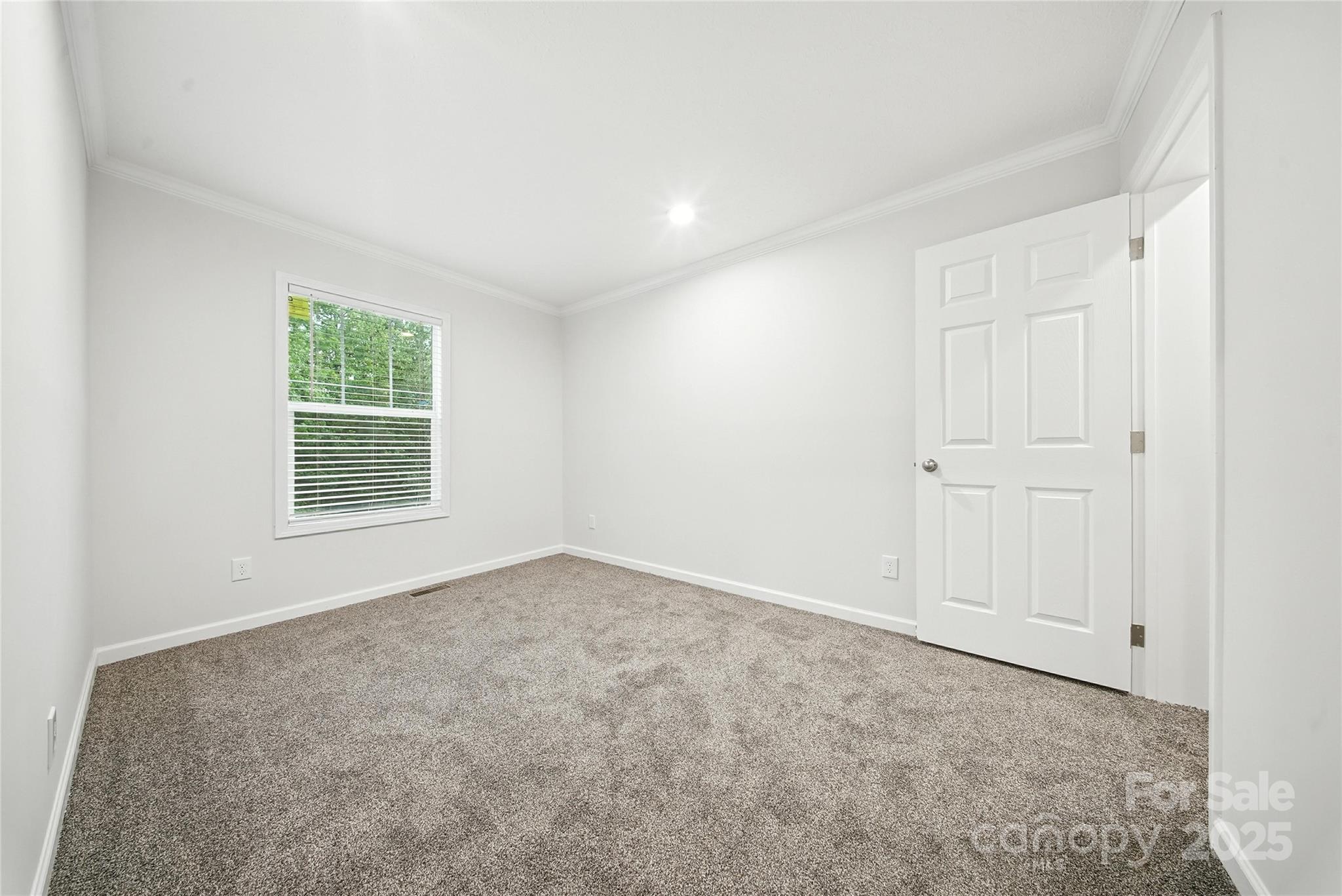 124 Dayton Road Dallas, NC 28034 - Photo 13 of 21 an empty room with windows