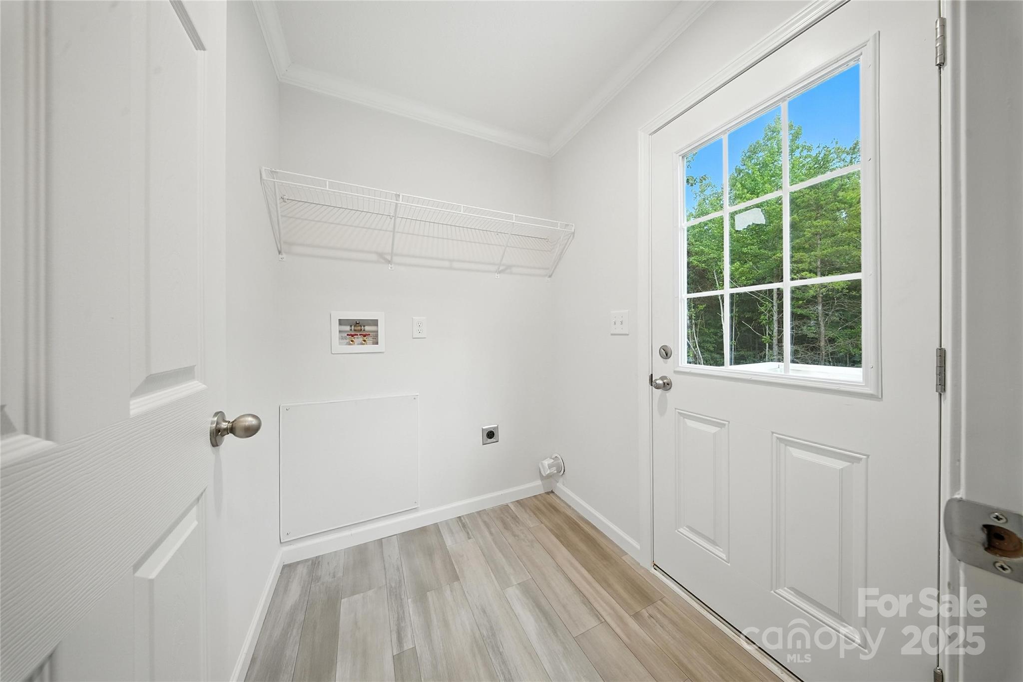 124 Dayton Road Dallas, NC 28034 - Photo 18 of 21 a view of empty room with wooden floor and fan
