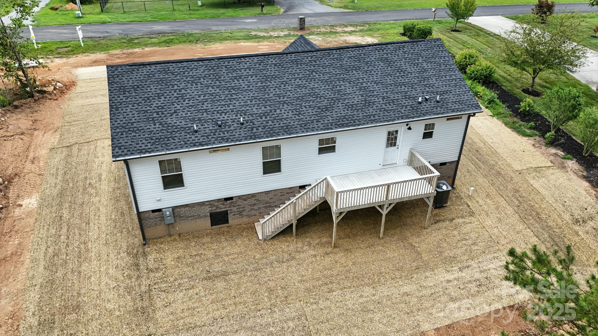 124 Dayton Road Dallas, NC 28034 - Photo 20 of 21 a backyard of a house with barbeque oven table and chairs