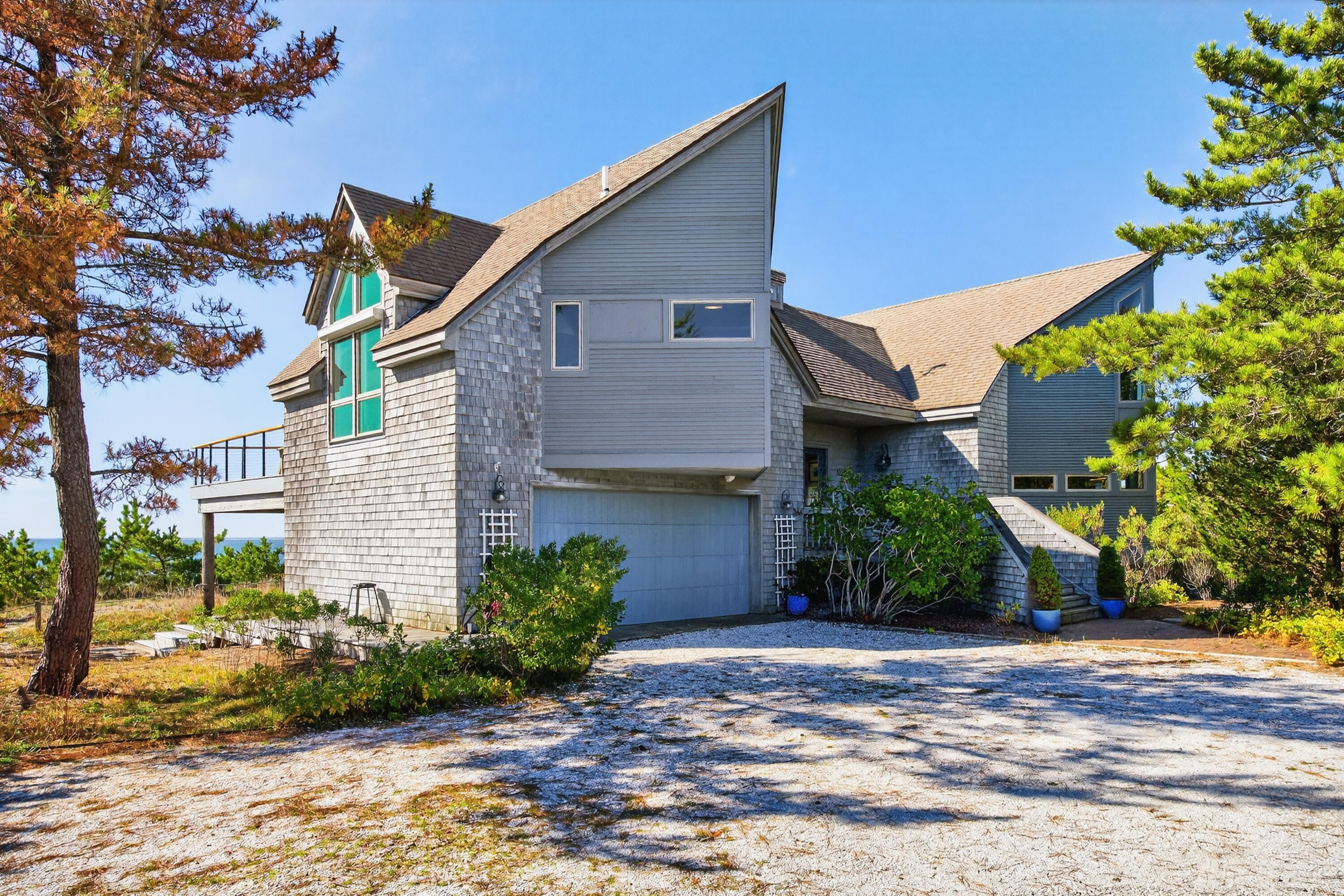 344 King Phillip Road Wellfleet, MA 02667 - Photo 11 of 72 a front view of a house with a yard