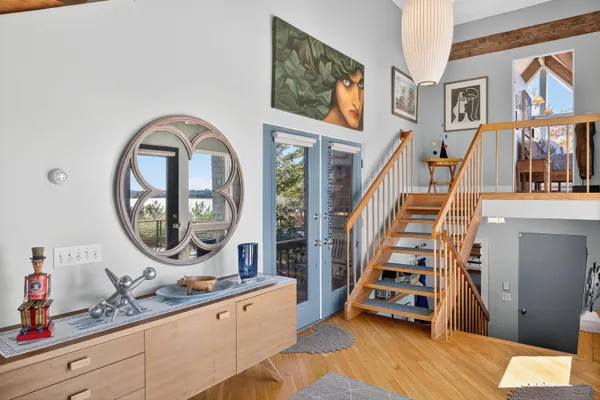 a living room with furniture and a book shelf