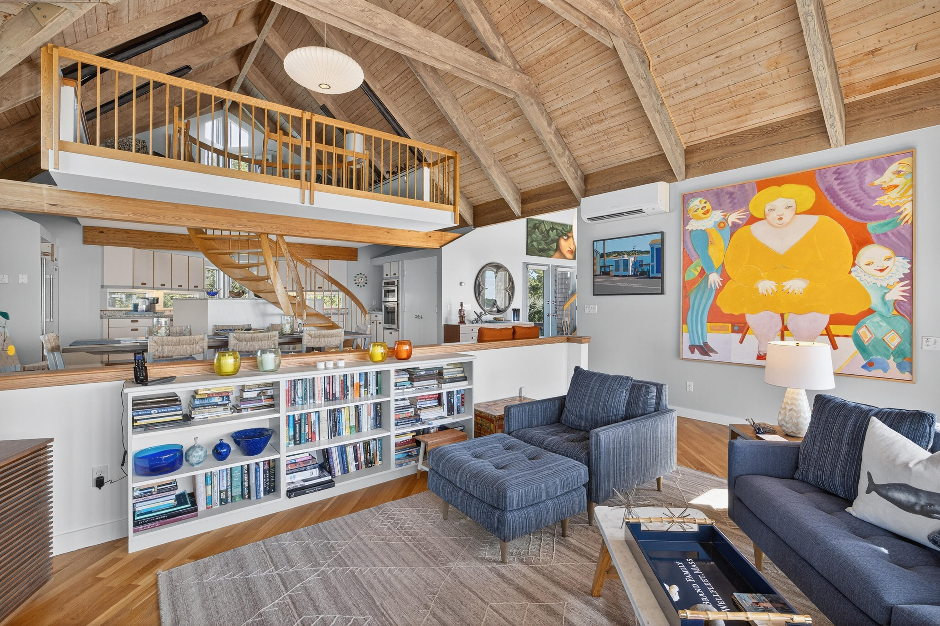 344 King Phillip Road Wellfleet, MA 02667 - Photo 22 of 72 a living room with furniture and a book shelf