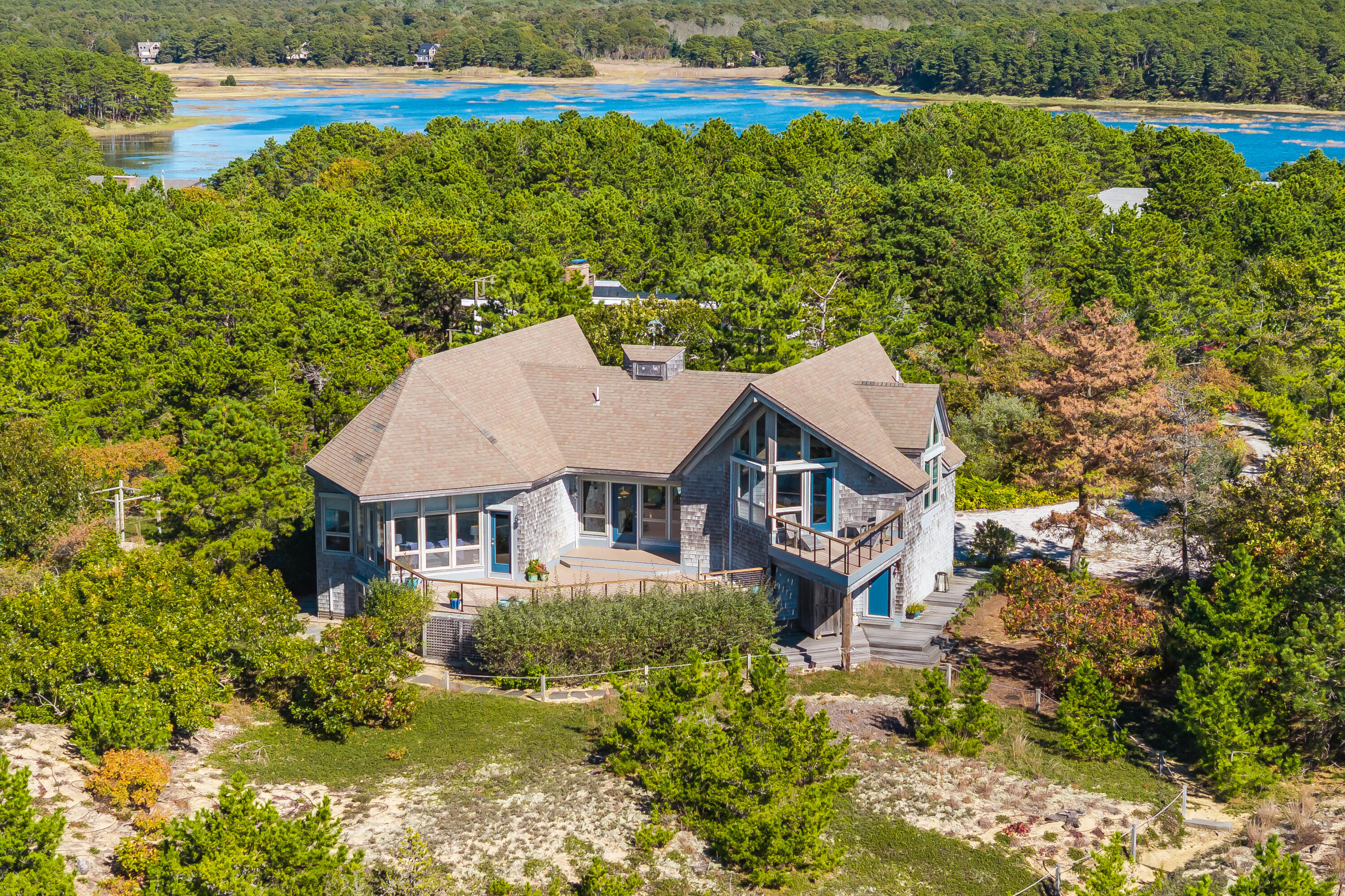 344 King Phillip Road Wellfleet, MA 02667 - Photo 60 of 72 a aerial view of a house with a yard table and chairs
