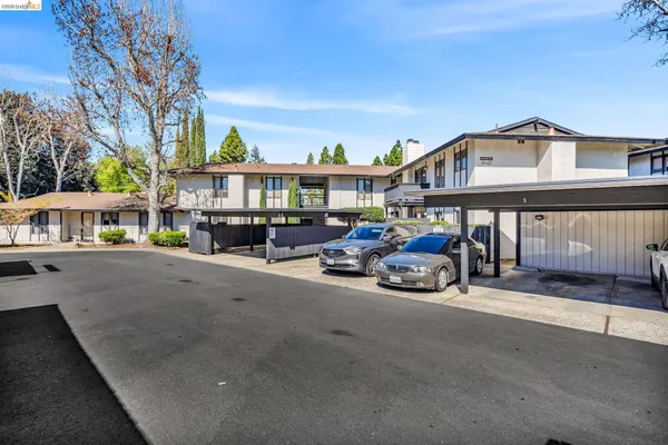 a view of a car park in front of house