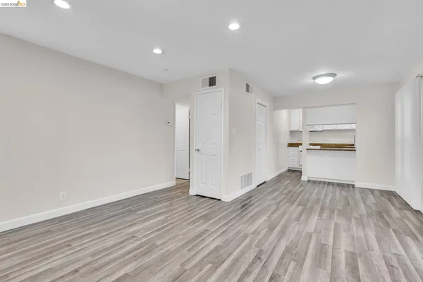 a view of a kitchen with wooden floor