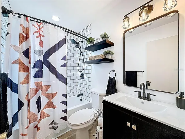 a view of a livingroom with wooden floor