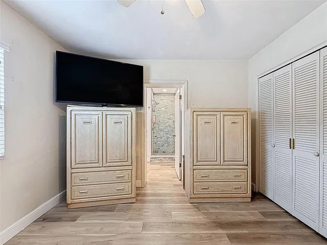 a bathroom with a double vanity sink mirror and toilet