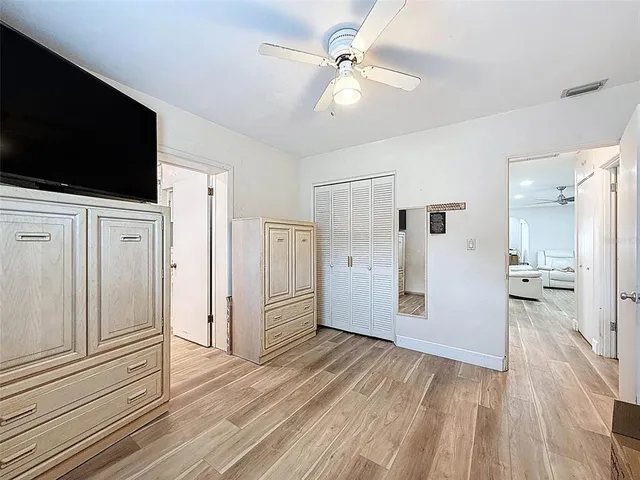 a bathroom with a granite countertop toilet a sink and shower