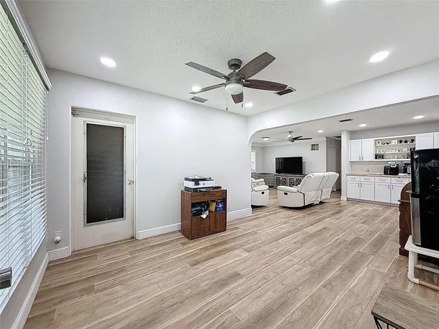 a living room with furniture and a large window