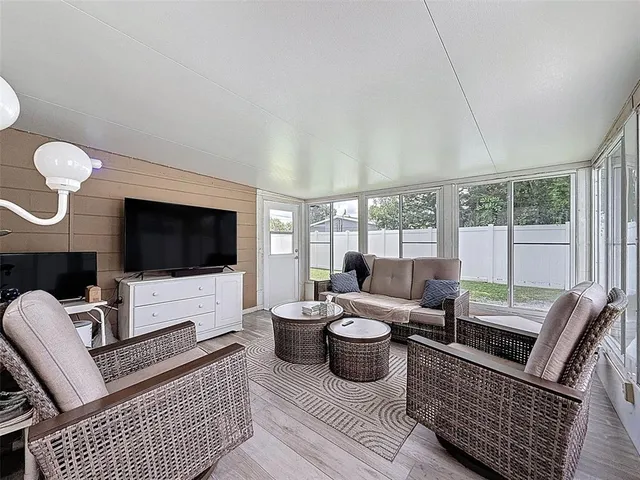 a view of a house with a yard and sitting area