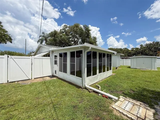 a backyard of a house with lots of green space