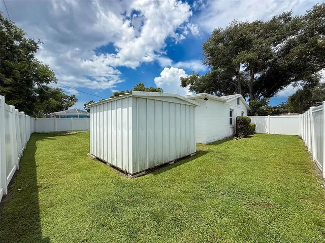 an aerial view of multiple houses with yard