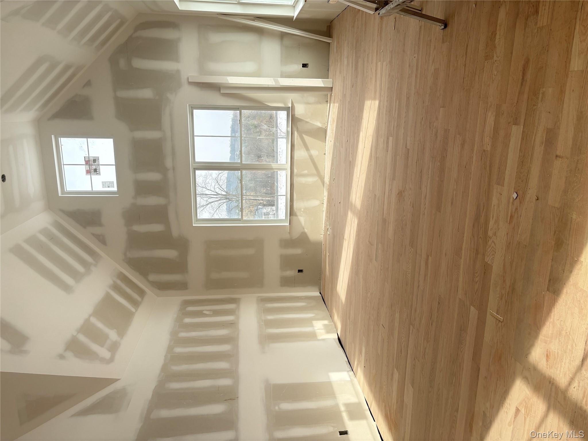 75 Delmar Hill Road Slate Hill, NY 10973 - Photo 13 of 23 Additional living space featuring high vaulted ceiling and light wood-type flooring