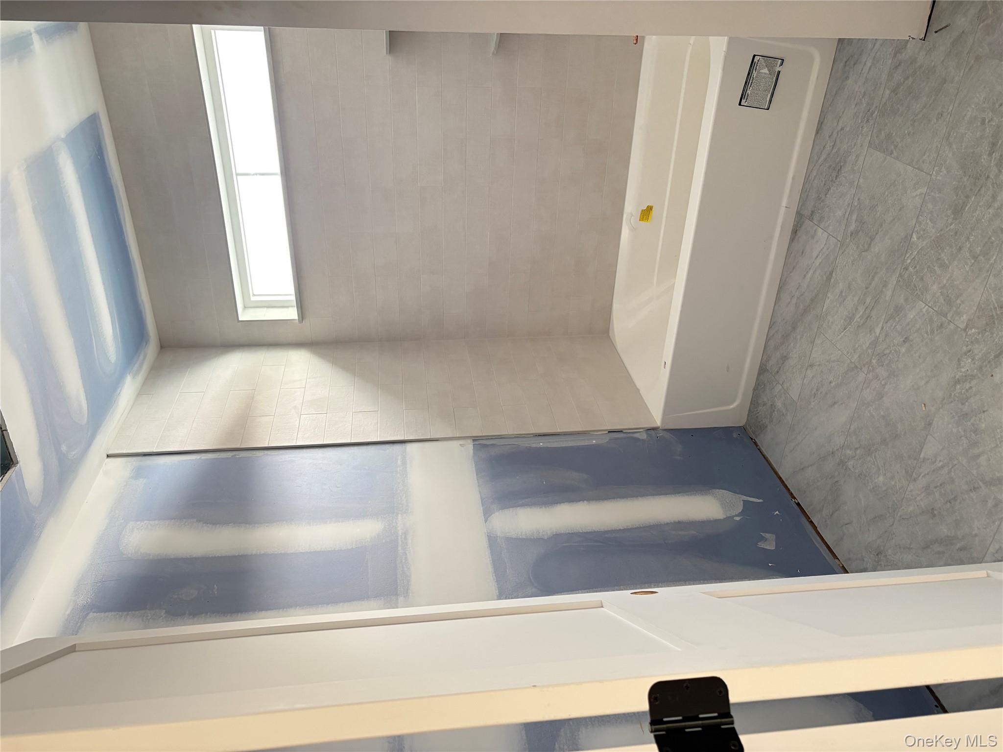 75 Delmar Hill Road Slate Hill, NY 10973 - Photo 19 of 23 a bathroom with a bathtub and a shower