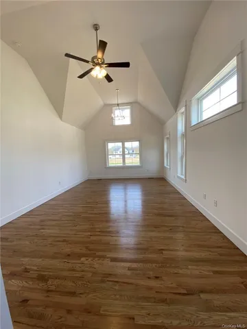 a view of an empty room with windows