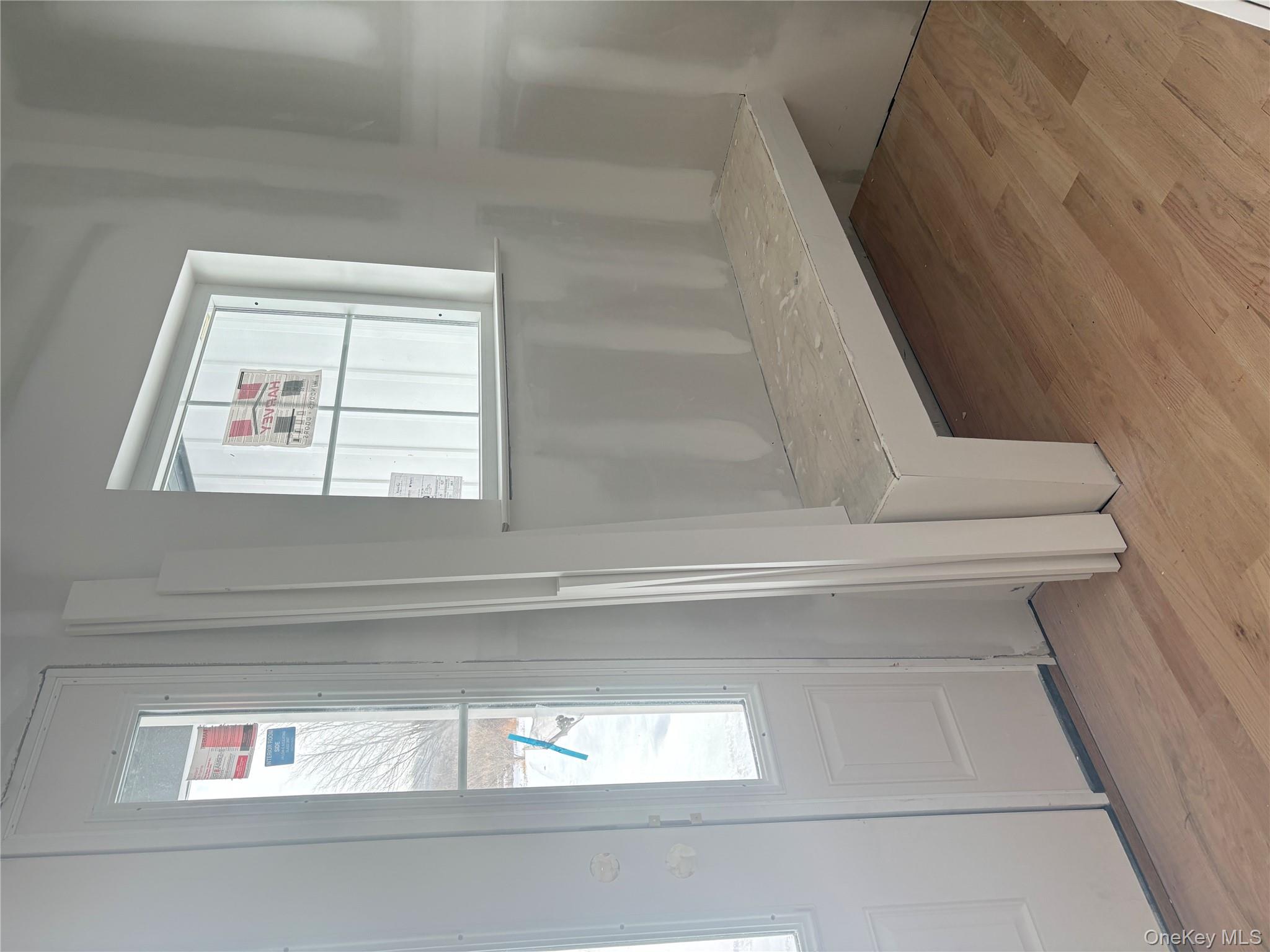 75 Delmar Hill Road Slate Hill, NY 10973 - Photo 7 of 23 an empty room with wooden floor and windows