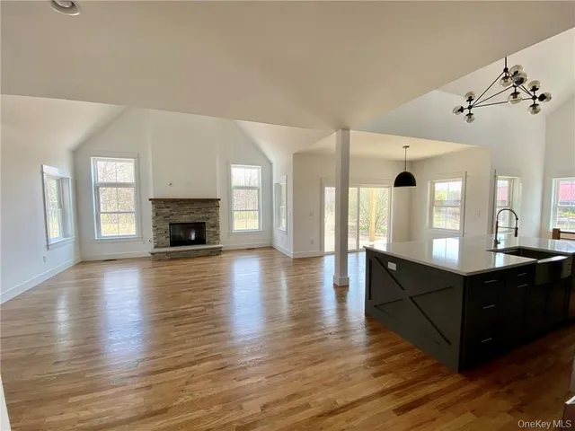 a view of a house with pool table and chairs