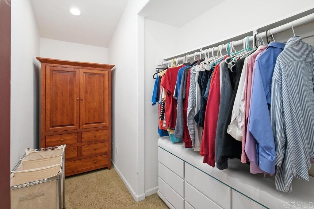 4730 Edinburgh Drive Carlsbad, CA 92010 - Photo 19 of 33 a view of walk in closet with clothes
