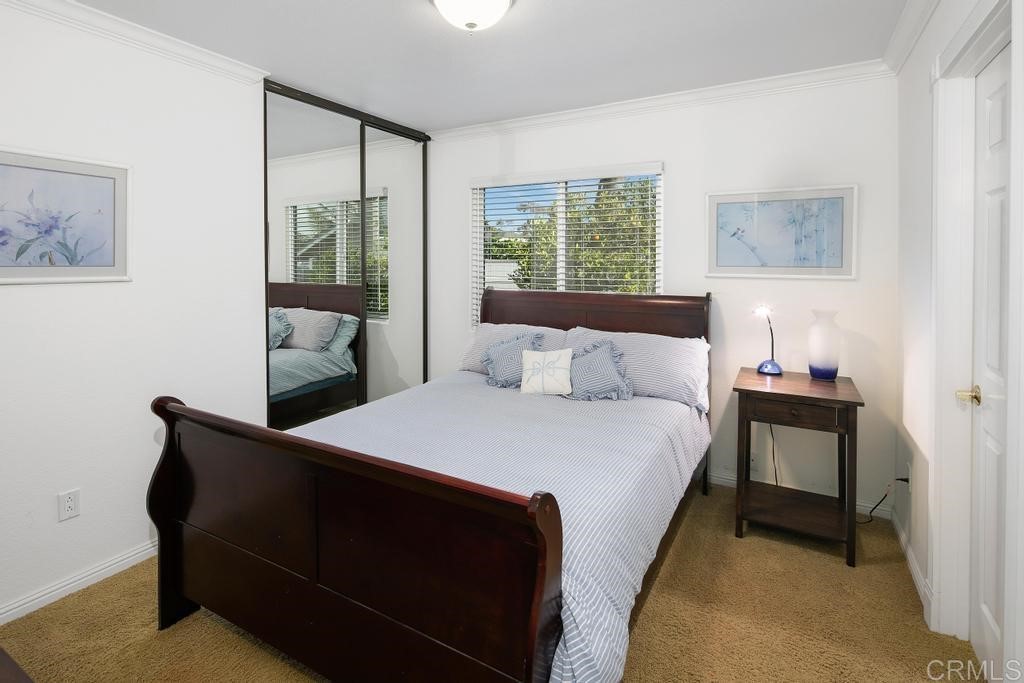 4730 Edinburgh Drive Carlsbad, CA 92010 - Photo 22 of 33 a bedroom with a bed and a window