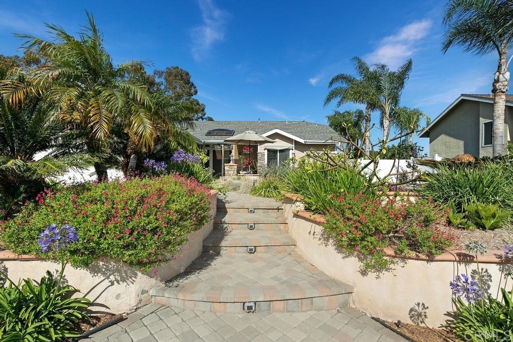 4730 Edinburgh Drive Carlsbad, CA 92010 - Photo 3 of 33 a view of a house with a yard and garden