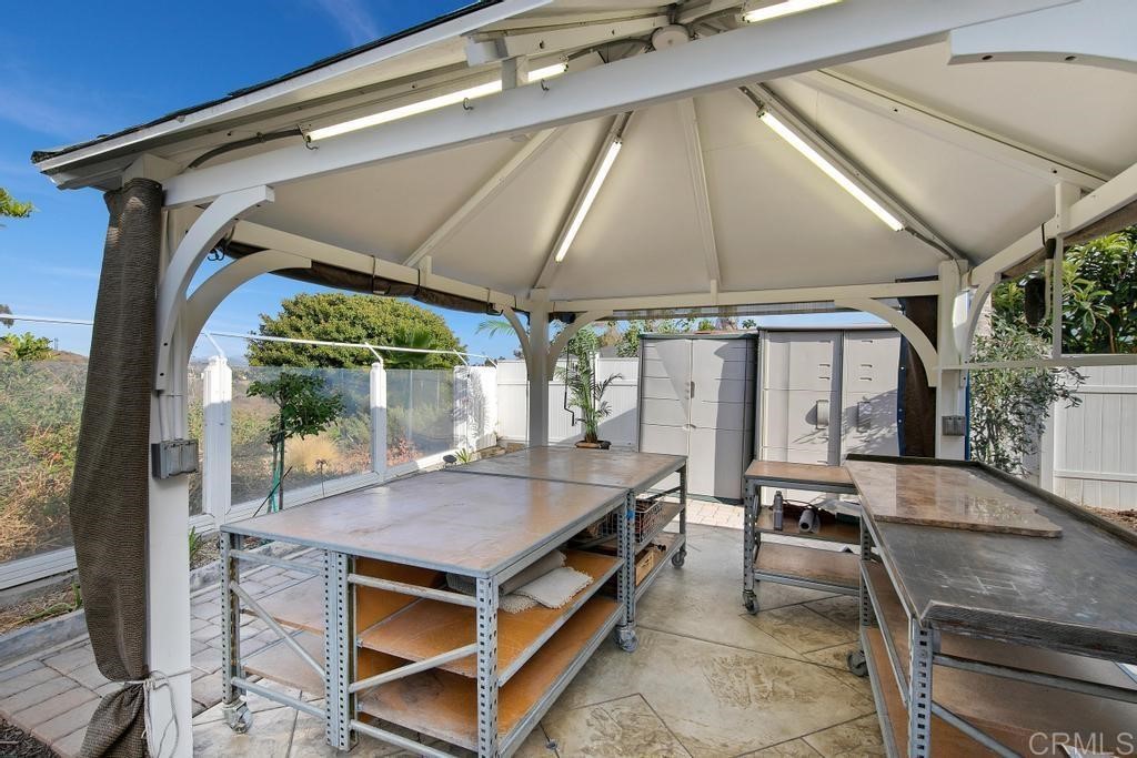 4730 Edinburgh Drive Carlsbad, CA 92010 - Photo 31 of 33 a backyard of a house with outdoor seating and barbeque oven