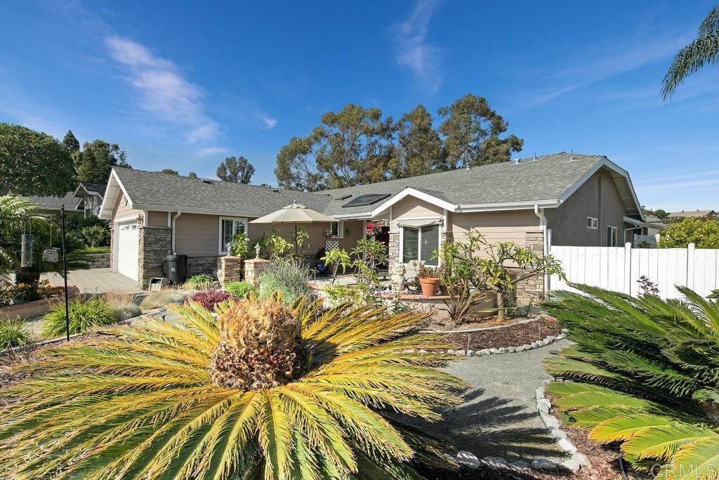 4730 Edinburgh Drive Carlsbad, CA 92010 - Photo 4 of 33 a view of a house with swimming pool and sitting area