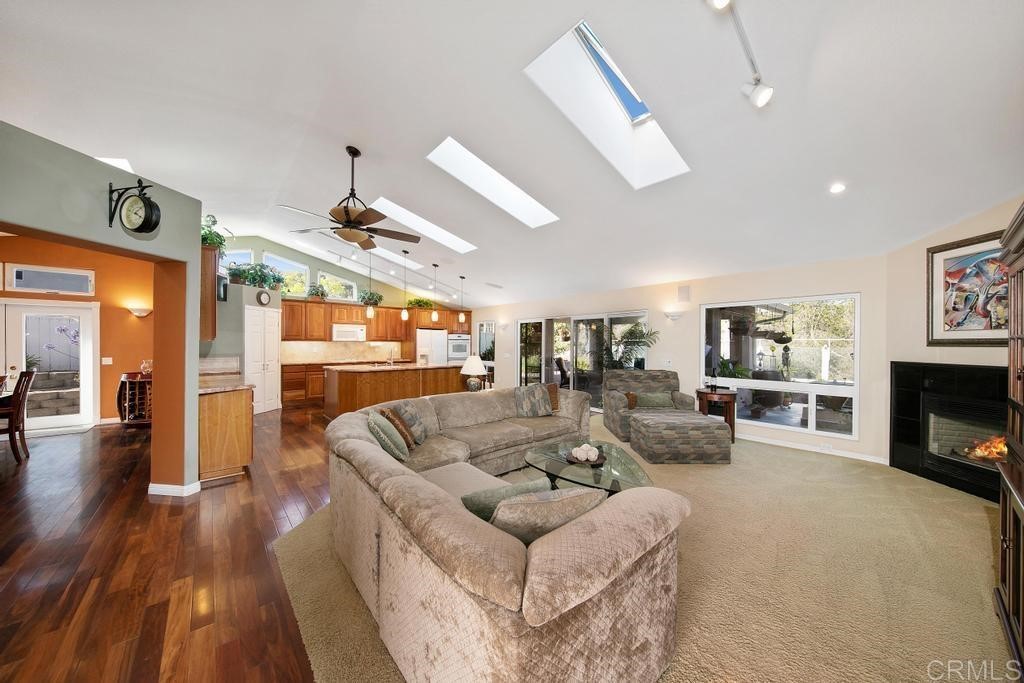 4730 Edinburgh Drive Carlsbad, CA 92010 - Photo 6 of 33 a living room with furniture and a fireplace