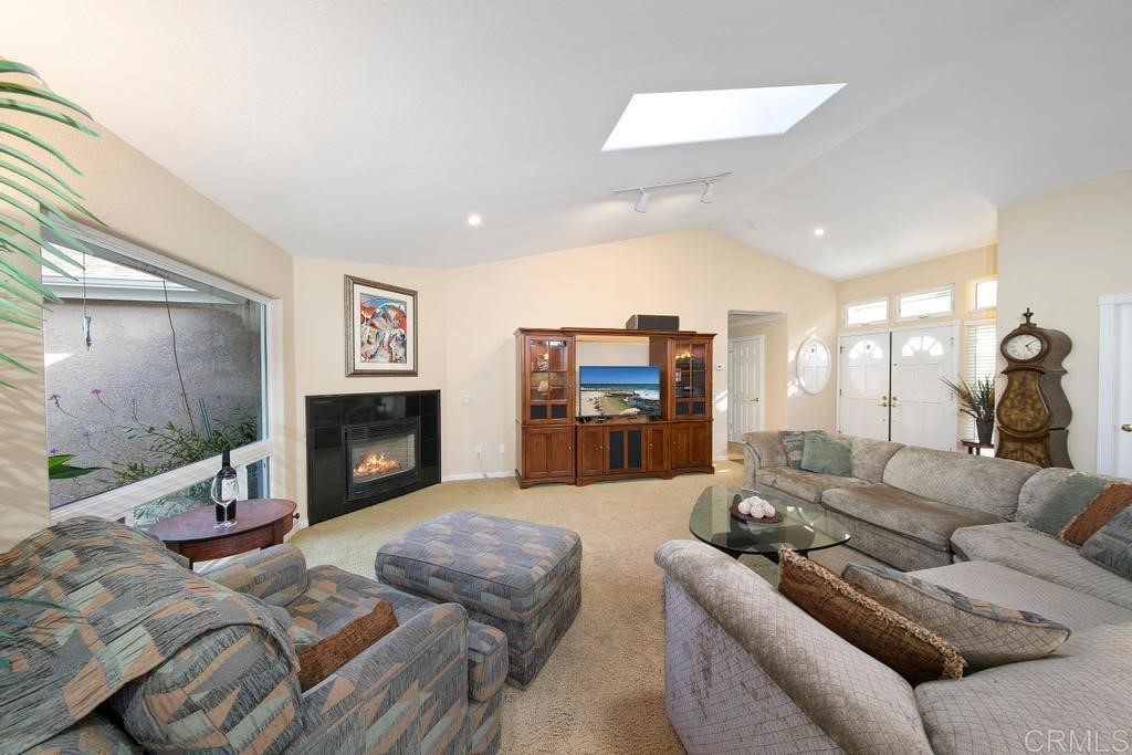 4730 Edinburgh Drive Carlsbad, CA 92010 - Photo 7 of 33 a living room with furniture and a fireplace