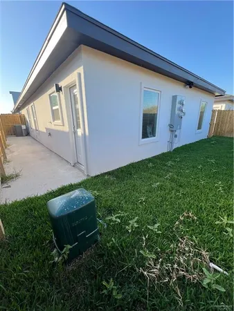 a view of backyard with trampoline